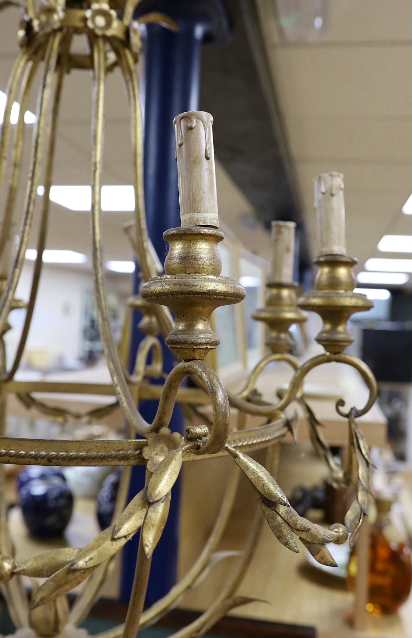 A gilt metal six light basket shaped ceiling chandelier